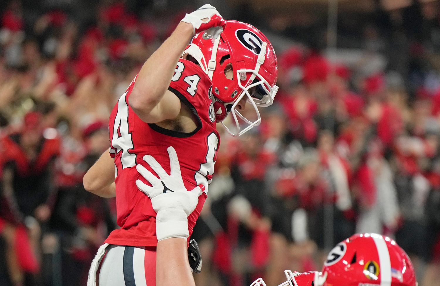 Georgia Bulldogs wide receiver Ladd McConkey celebrates a touchdown during a college football game in the SEC.